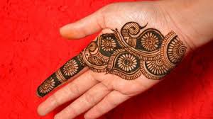 Floral Patterns On The Palm Of A Hand Dark Brown Finger Henna With Daisy Like Shapes Running Down To The Wrist Palm Mehndi Design Henna Designs Hand Henna