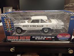 Color Chrome car is autographed by Tony. This group includes 1999 Tony Top  Fuel Champion hat (new), Medium size Army shirt (new) , Army Dog tag, and  Army challenge coin.