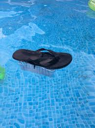 Diy Floating Chlorine Dispenser For A Swimming Pool Zip Tie A Small Plastic Basket To A Flip Flop Diy Swimming Pool Pool Chlorine Pool Cleaning Tips