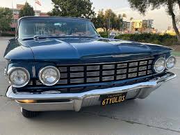 Image result for Turquoise 1960 Oldsmobile