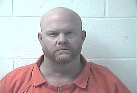 A Kentucky man was taken into custody after he allegedly rear-ended an  officer at a red light at around 3 a.m.