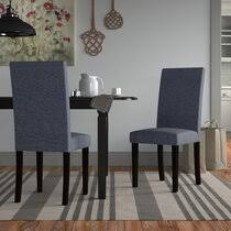 Bonded leather in brown or off white or blue in fabric. Cheap Dining Chairs Wayfair