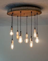 Pin By La Cave Dourthe Vin De Bordeau On Made On Hatch Co Wine Barrel Chandelier Wine Barrel Rings Wine Barrel Furniture