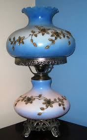 Pink and blue floral pattern on blue tinted white glass and antique brass finished hurricane lamp. Antique Parlor Lamps Ideas On Foter