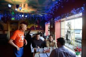 Businesses are united in orange, divided in how to express it