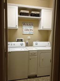 Create a powder room that also serves as a small laundry with hidden cabinets. Small Laundry Room Storage Cabinets Novocom Top