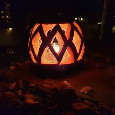 A halloween witch flying on a broom with a full moon night sky fall in backyard with leaves falling from trees and halloween pumpkin scarecrow, autumn background. 60 Easy And Cool Pumpkin Carving Ideas For Halloween 2021