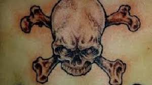Tatuajes corporales y body piercing Skull Crossbone Tattoos And Meanings Skull Crossbone Tattoo Ideas And Designs Hubpages