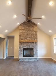 Stone Fireplace With Vaulted Ceiling And Wood Beam Vaulted Ceiling Lighting Beams Living Room Ceiling Beams Living Room