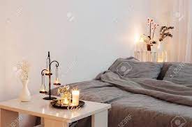 Candles and flowers in bedroom. Night Interior Of Bedroom With Flowers And Burning Candles Stock Photo Picture And Royalty Free Image Image 154543867