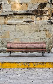 Mix the mortar is directed to by the manufacturer's guidelines and apply a 2 inch thick layer to the surface. Spain Andalusia Tarifa Wooden Bench In Front Of Stone Wall Stockphoto