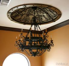 Six light spanish style wrought iron chandelier with large pendulum and sphere shaped crystal drops. Rustic Doors Rustic Double Doors Custom Door Demejico