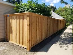 Minimalist aluminum fence in grey. Wood Fence Chicago Residential Wood Fence Company