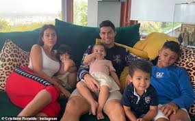 Cristiano ronaldo is a professional soccer player who has set records while playing for the manchester united and real madrid clubs, as well as when cristiano ronaldo was just 16 years old, manchester united paid more than £12 million to sign him — a record fee for a player of his age. Cristiano Ronaldo Looks Delighted As He Poses With Girlfriend Georgina And His Four Children Daily Mail Online