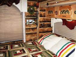 Camper that looks like a cabin. Couple Gets Closer To Nature With A Custom Log Cabin Interior