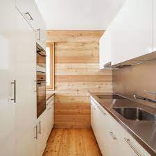 We share 9 ways you can design your small kitchen to in this kitchen, concealing the fridge and dishwasher behind cabinetry panels gives the small space a tidy look. Fantastic Space Saving Galley Kitchen Ideas