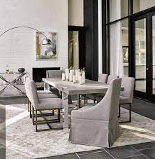 A Different Kind Of Dinner Roll Casters Add Easy Mobility To Skirted Tailored Chairs In 100 Belgian Li Dining Sets Modern Luxury Dining Room Grey Dining Room