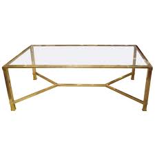 This clampdown rectangle coffee table has an alluring appeal that simply cannot be denied. Vintage French Glass And Brass Coffee Table 1stdibs Com Coffee Table Brass Coffee Table Modern Glass Coffee Table