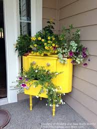 Place a rolling cart on your front porch and add a mix of seasonal decorating pieces, potted plants and flowers. Decorating With Flowers Front Porch Decorating Porch Pictures