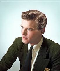 Young Roger Moore in an advertisement photograph for a hair product 1960