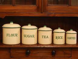 This set is in very good vintage condition for its age. Set Of Old Enamel Kitchen Canisters The Merchant Of Welby