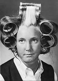 Yes! My hair is naturally curly, the bane of my existence during the  straight-as-you-can-wear-it '60s! Besides slopping it with DippityDoo and  wrapping my goopy hair around my head to sleep in, Cathy