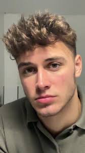 Person in Olive Green Shirt in Minimalist Room