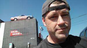 Vintage postcard with cowboy and car