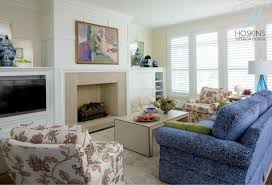 Asymmetrical living room design with fireplace. Project Highlight Village Of West Clay Great Room Design