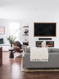 Gray Sofa Leather Accent Chairs Tv Over The Fireplace Open Shelves On Either Side Of The Fire Brown Living Room Decor Living Room Diy Living Room Designs
