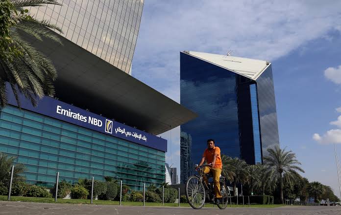  A man rides a bicycle past Emirates NBD head office in Dubai, UAE on January 30, 2018. &mdash; Reuters/File 