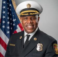 LAFD Central Deputy Chief Phillip Fligiel, congratulating Kyle Rausch