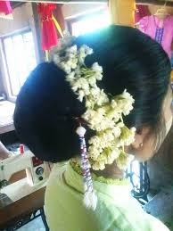 What A Beautiful Low Bun With Real Flower Gajra Care However Should Be Taken Before Adopting Such Hairstyles As Du Big Bun Hair Bridal Bun Low Bun Hairstyles