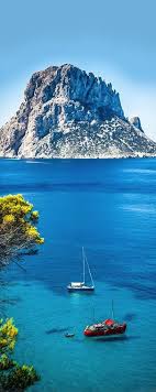 Ibiza Spain A Small Beloved Beach With Fantastic Views Of The Mysterious Island Of Es Vedra Cala D Hort Is A Must Visi Ibiza Spain Beautiful Places Travel