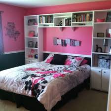A black, pink and white bedroom with a black statement wall, pink bedding, a striped rug and some girlish decorations a refined and glam pink bedroom with luxurious textiles, exquisite furniture and lamps plus blooms in a vase Pin On Bedroom Decor