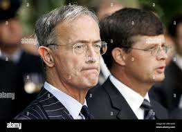British ambassador Colin Budd, left, and Dutch Prime Minister Jan Peter  Balkenende, right, are seen during a commemoration in The Hague, the  Netherlands, Thursday, July 14, 2005. Citizens in the Netherlands, Britain