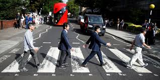 Behind the beatles' most famous photograph. Beatles Fans Recreate Iconic Abbey Road Album Cover 50 Years On