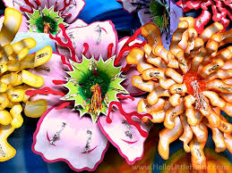Use mardi gras beads as simple and inexpensive napkin holders for a mardi gras dinner. Behind The Scenes At Mardi Gras World New Orleans Hello Little Home