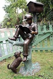 Reading Boy Mailbox Statue - Life Size A Dog Seems Eager To Climb Up The Tree And Join Its Owner As He Reads His Book Book Sculpture Sculptures Garden Statues
