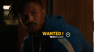 Sweatshirt blue zipped side stripes of Erik Killmonger (Michael B. Jordan)  in a Black Panther