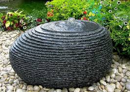 In landscape architecture and garden design, a water feature is one or more items from a range of fountains, jeux d'eau, pools, ponds, rills, artificial waterfalls, and streams. Granite Rock Water Fountains Stone Carving Water Features Handmade Black Granite Sculpture Egg Patio Water Feature Water Fountains Outdoor Fountains Outdoor