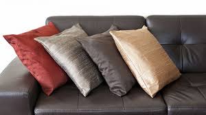 Throw pillows in autumn colors such as deep red, mustard yellow, or peach tones pair naturally with a brown couch. How To Choose Throw Pillows For Your Brown Couch Homenish
