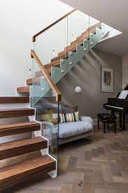 The design cabin at housing.com's mumbai office. Trim White Steel Walnut Staircase House Steps Design Steps Design Stairs Design Interior