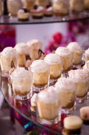 In Addition To Wedding Cake Other Desserts Were Served Including Tres Leches Cake Bites In Shot Glasses Cake Shots Mexican Dessert Table Desserts