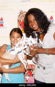 Zoe Madeleine Donovan and her mom Audra McDonald with Chachi and Drago, two  dogs up for adoption Broadway Barks: The 14th Annual Dog and Cat  Adopt-a-thon held in Shubert Alley New York City, USA