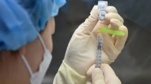 A worker performs a quality check in the packaging facility of chinese vaccine maker sinovac biotech in beijing, china, september 24, 2020. Hong Kong Suspends Pfizer Vaccines Citing Packaging Defects Al Arabiya English