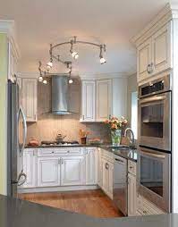 While inset can lights could have been used, the pendants add such a nice touch. Small Kitchen Remodels Home Design Ideas Pictures Remodel And Decor Small Kitchen Lighting Kitchen Design Small Kitchen Remodel Small