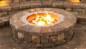 Continue building the wall of the fire pit by alternating layers of face stone and fire brick until desired once you've established your first capstone, and built up the body of the wall (image 1) and fire brick. Keystone Hardscapes Retaining Walls Permeable Pavers Erosion And Outdoor Living Projects