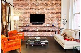 This example, complete with exposed duct work, features a brick wall with loads of character to spare. Exposed Brick Living Room Decor Home Decoration Design Ideas