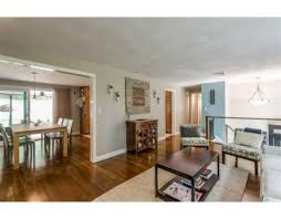 The living area is actually raised off the ground even though the entryway is at ground level. Kentfield New Interior Design For A 1970 S Ranch Home Inspired By Client S Art Collection Living Room Remodel Living Room Decor On A Budget Ranch Kitchen Remodel